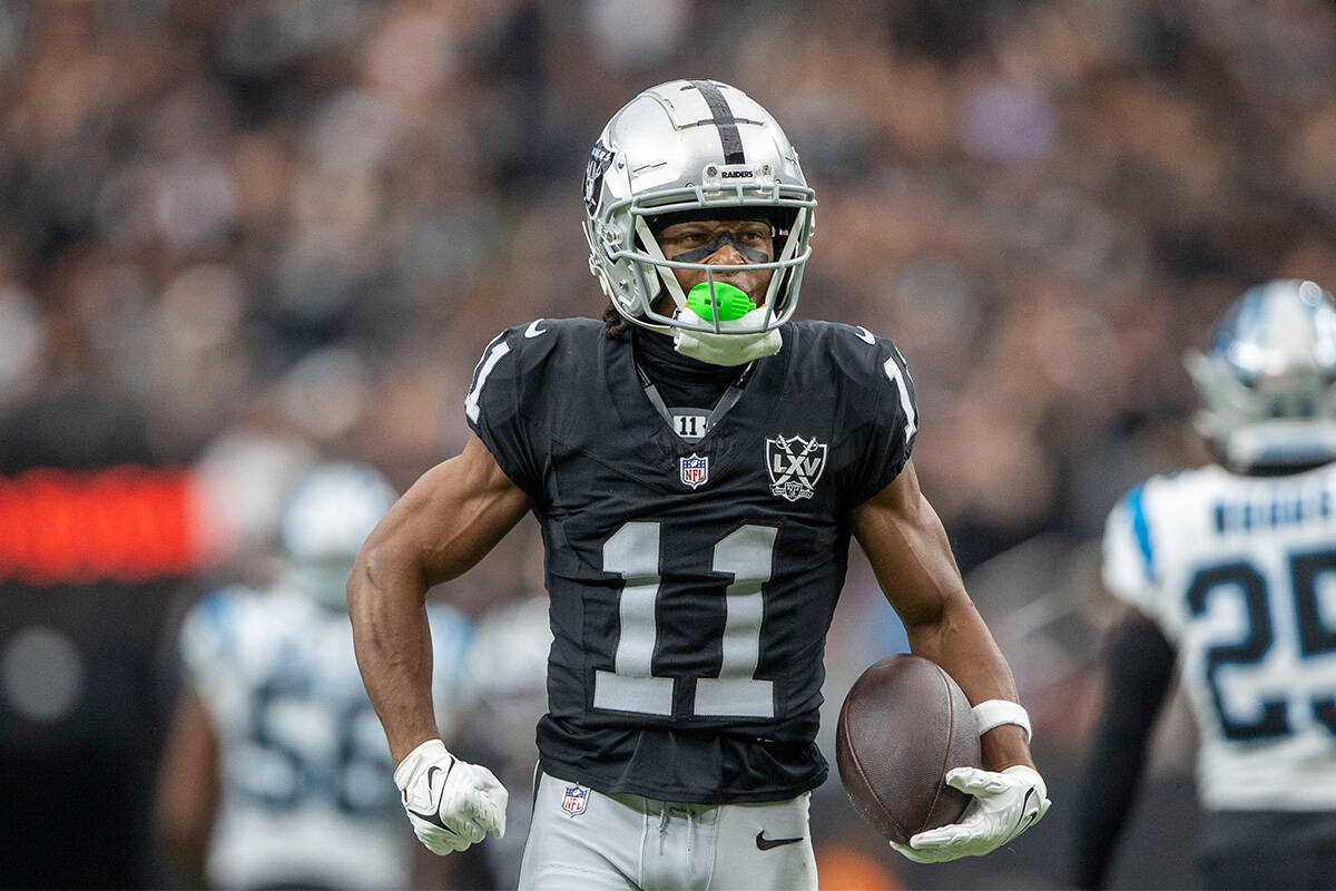 Raiders wide receiver Tre Tucker (11) flexes after making a big catch during the first half of ...