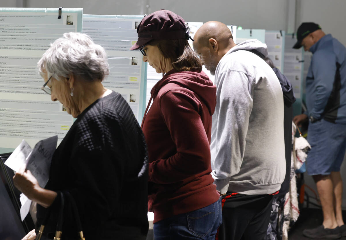 People cast their vote during early voting at Thunderbird Family Sports Complex, on Saturday, O ...