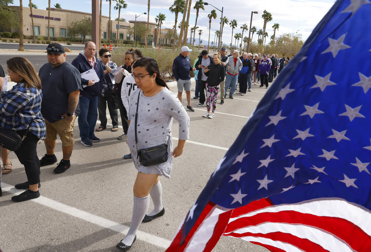 People Line up to cast their vote during early voting at Thunderbird Family Sports Complex, on ...