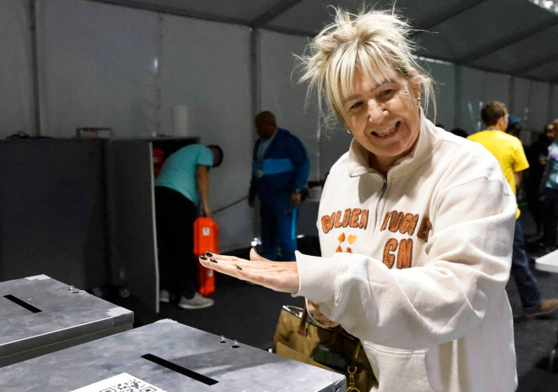 Pauline Shackelford reacts after dropping her ballots in an official mail-in ballot drop box du ...