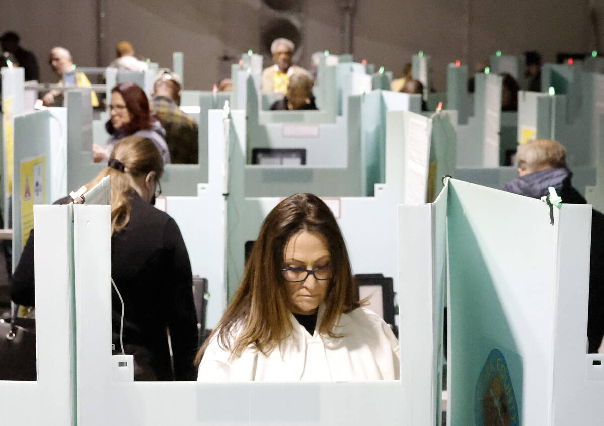 People cast their vote during early voting at Thunderbird Family Sports Complex, on Saturday, O ...