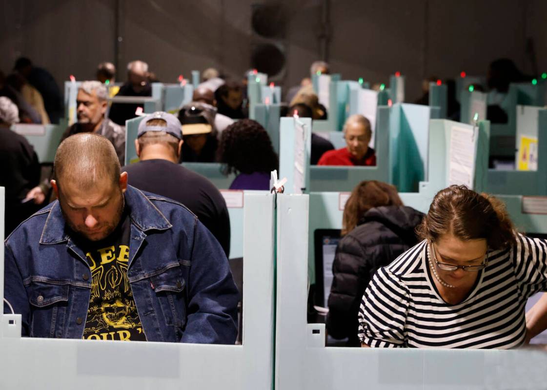 People cast their vote during early voting at Thunderbird Family Sports Complex, on Saturday, O ...