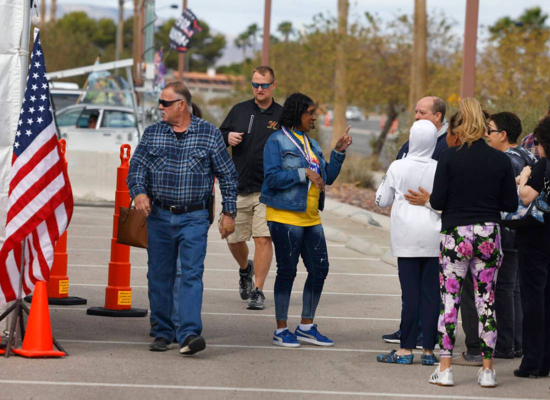 People line up to cast their vote during early voting at Thunderbird Family Sports Complex, on ...