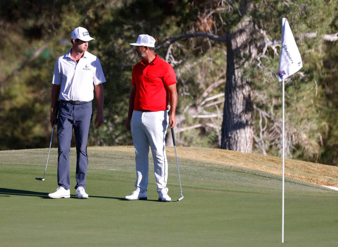 Harris English, left, and Scott Piercy chat as they wait for their turns at green No.8 during t ...