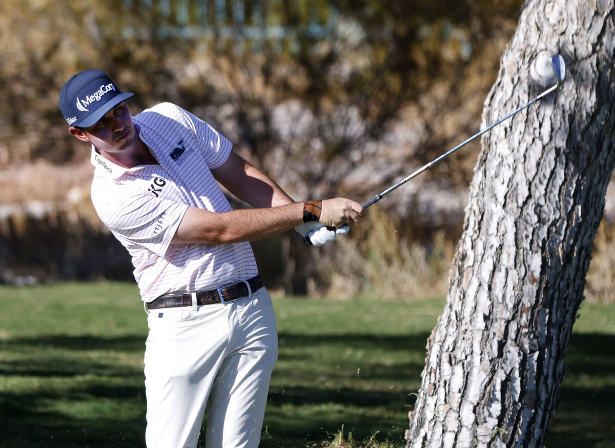 J. T. Poston watches an approach shot from the 6th fairway during the third round of the Shrine ...