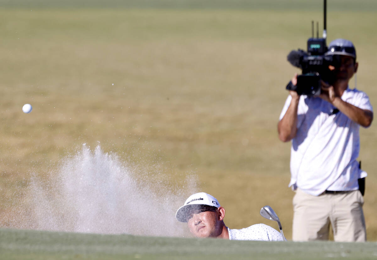 Rico Hoey blasts out of a bunker at green No. 4 during the third round of the Shriners Children ...