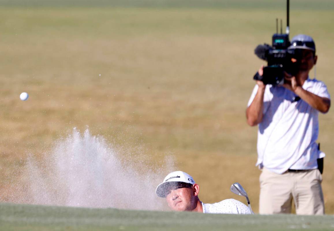 Rico Hoey blasts out of a bunker at green No. 4 during the third round of the Shriners Children ...