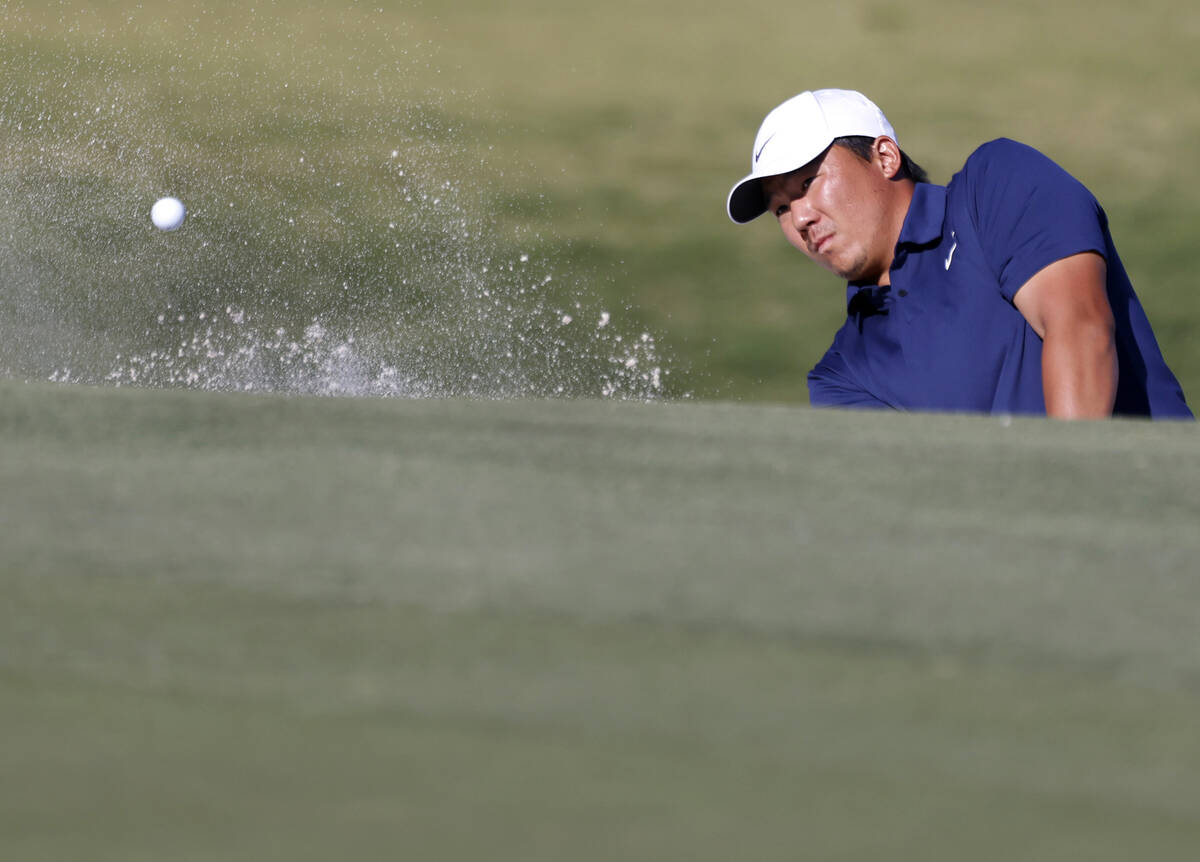 Norman Xiong blasts out of a bunker at green No. 2 during the third round of the Shriners Child ...