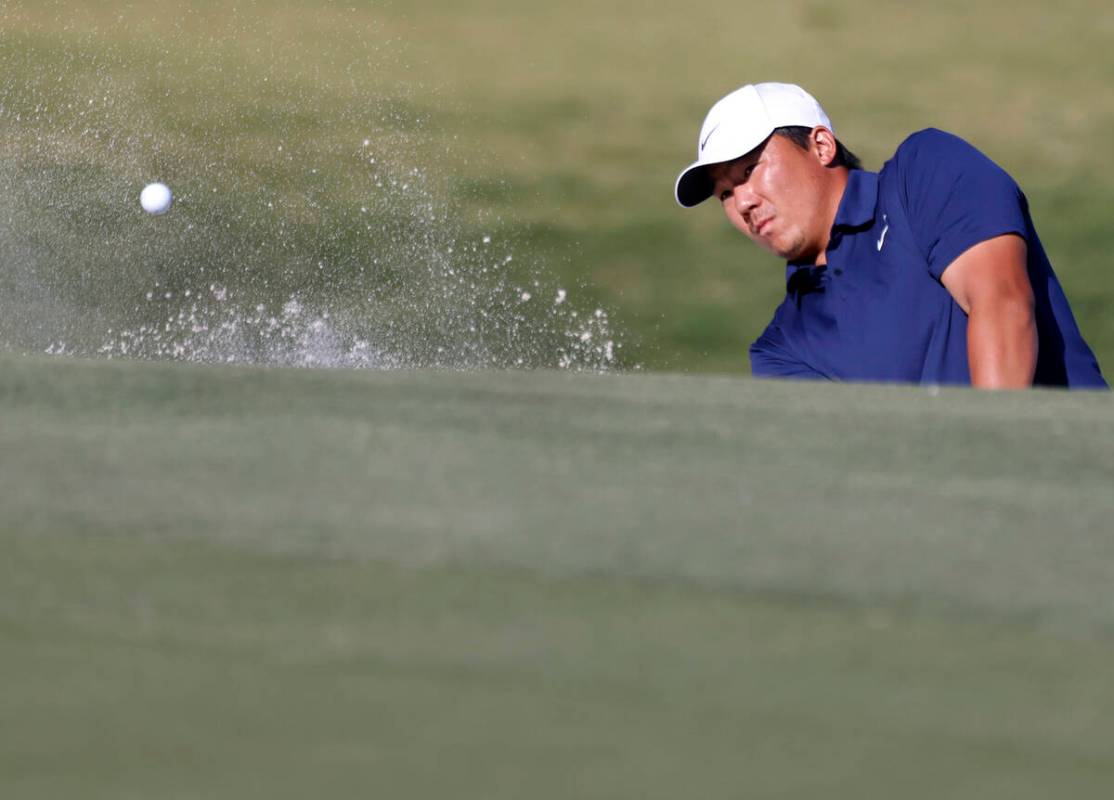 Norman Xiong blasts out of a bunker at green No. 2 during the third round of the Shriners Child ...