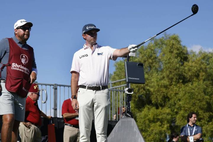 J. T. Poston consults his caddie before teeing off on the 1st during the third round of the Shr ...