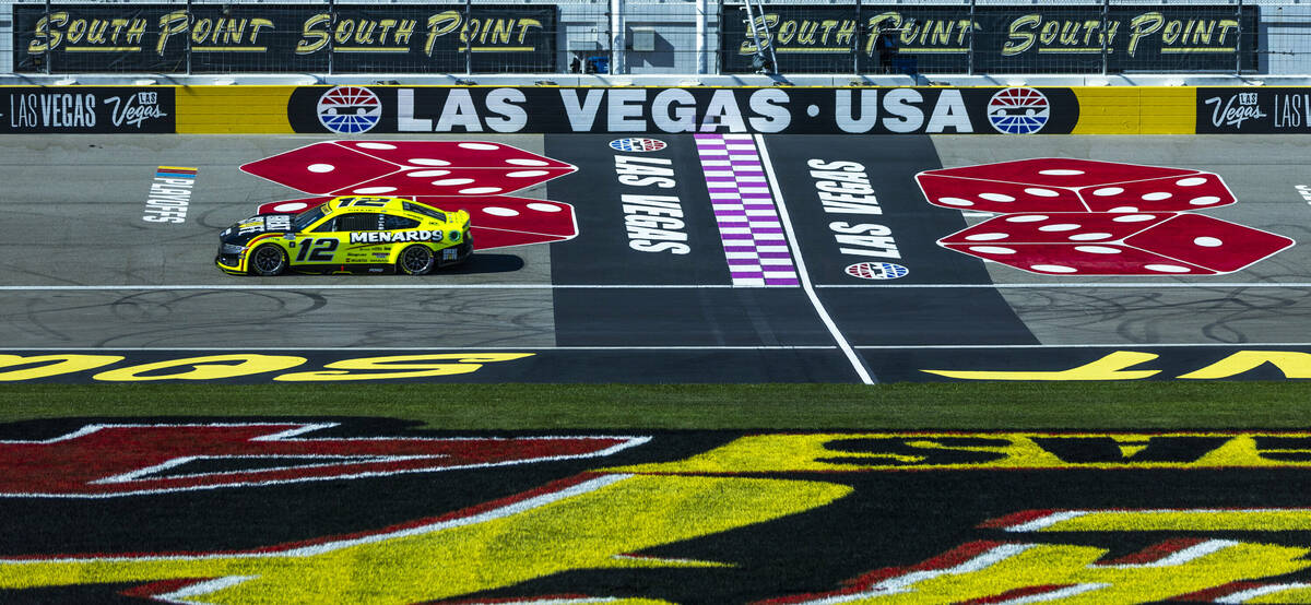 Ryan Blaney (12) passes the start/finish line during the NASCAR Cup Series practice session for ...