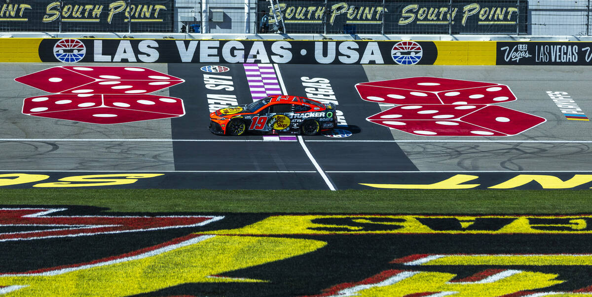 Martin Truex Jr. (19) passes the start/finish line during the NASCAR Cup Series practice sessio ...