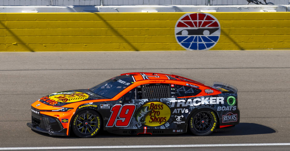 Martin Truex Jr. (19) makes his way around the track during the NASCAR Cup Series practice sess ...