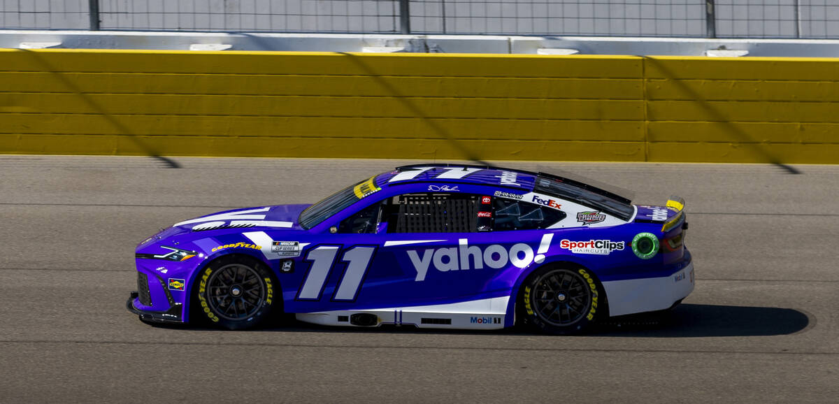 Denny Hamlin (11) makes his way around the track during the NASCAR Cup Series practice session ...