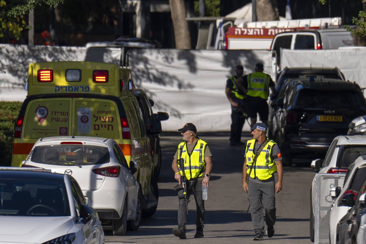 Israeli security forces secure a road near where Israel's government says a drone launched towa ...