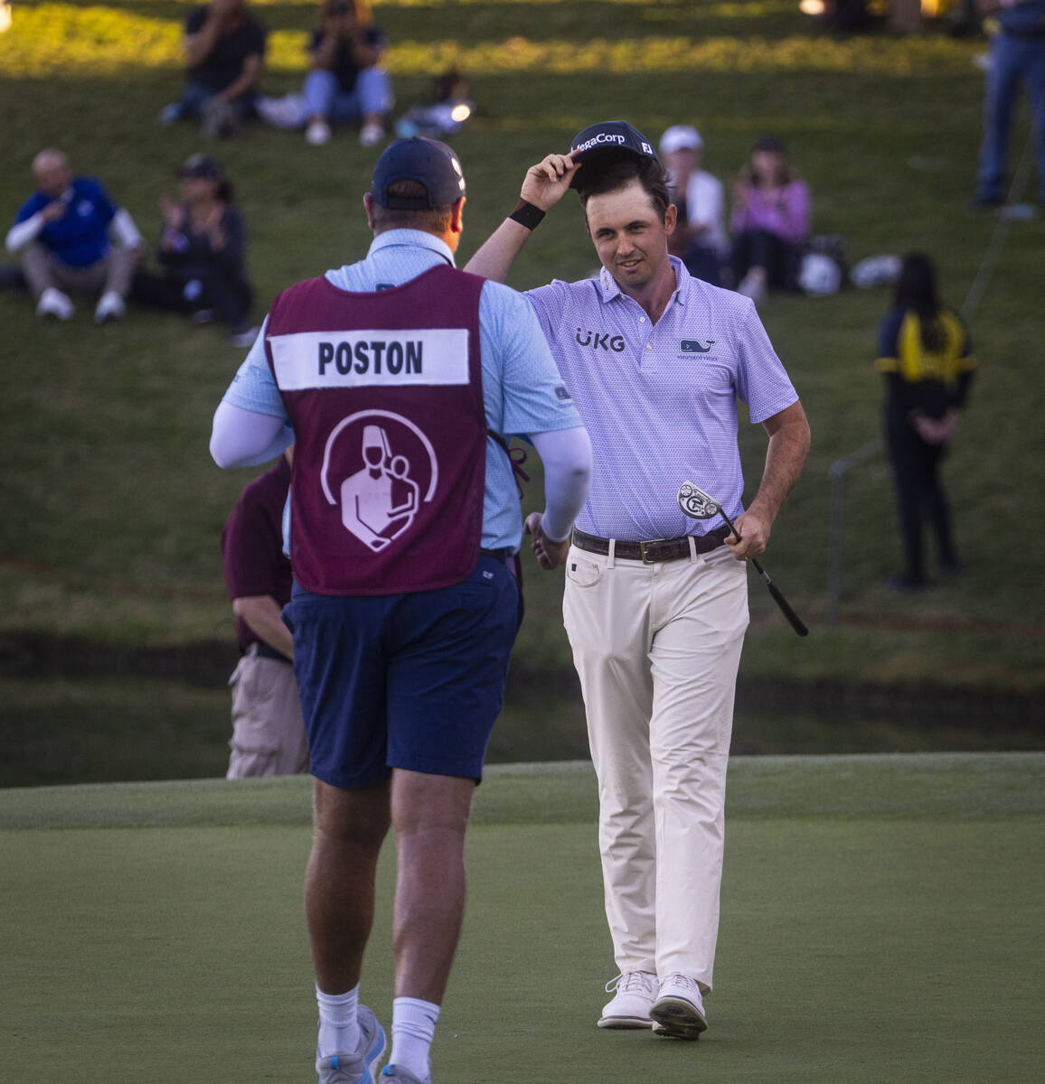 J.T. Poston, right, celebrates with his caddie Aaron Flener after winning the Shriners Children ...