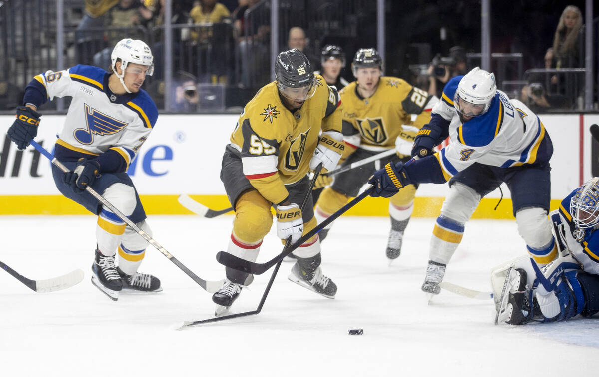 St. Louis Blues defenseman Nick Leddy (4) snaps the stick of Golden Knights right wing Keegan K ...