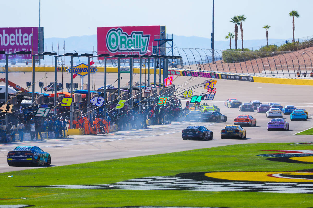 NASCAR drivers drive off from pit row during the South Point 400 NASCAR Cup Series race at the ...