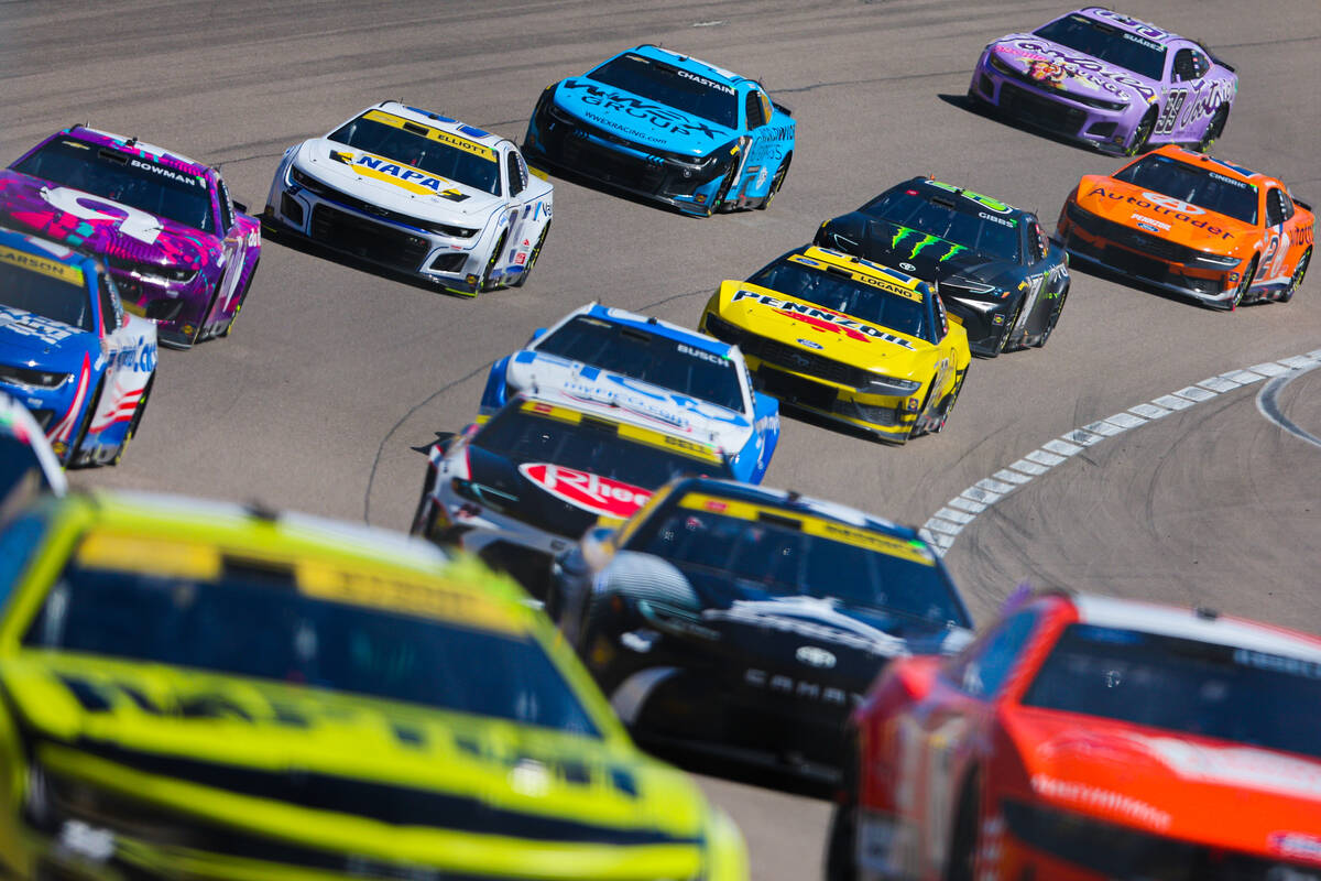 Drivers zoom by during the South Point 400 NASCAR Cup Series race at the Las Vegas Motor Speedw ...