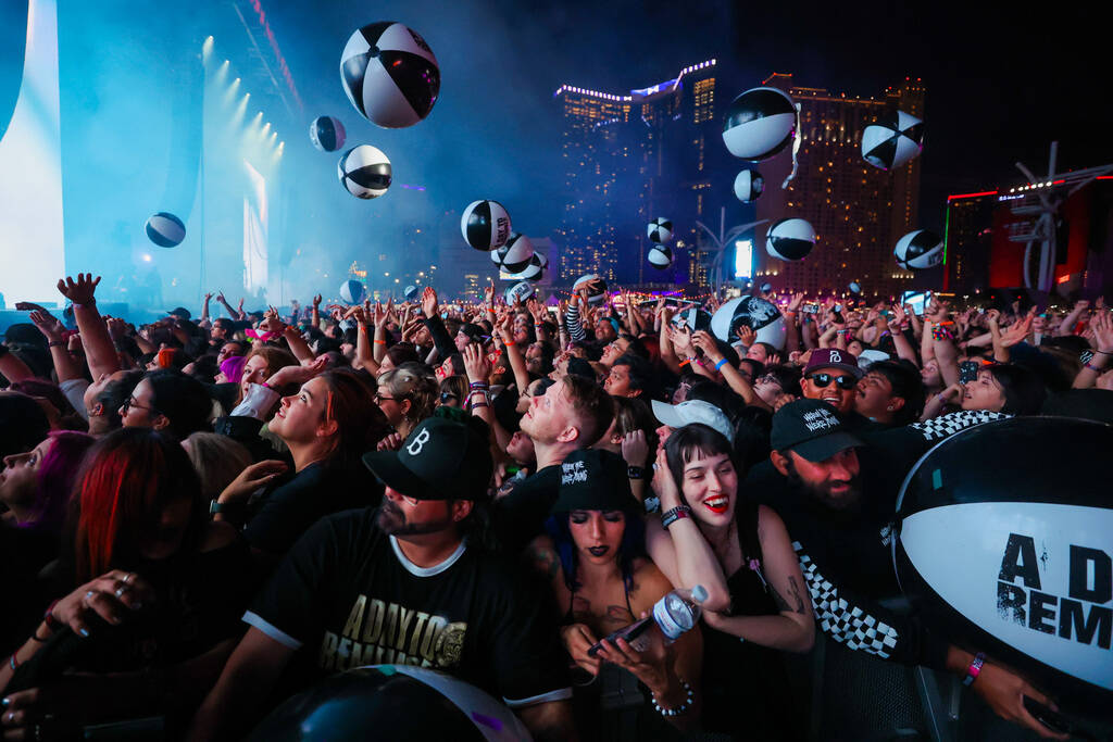 Beach balls float around during A Day To Remember’s set during the When We Were Young mu ...