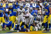 Raiders cornerback Nate Hobbs (39) celebrates his fourth down stop of Los Angeles Rams running ...