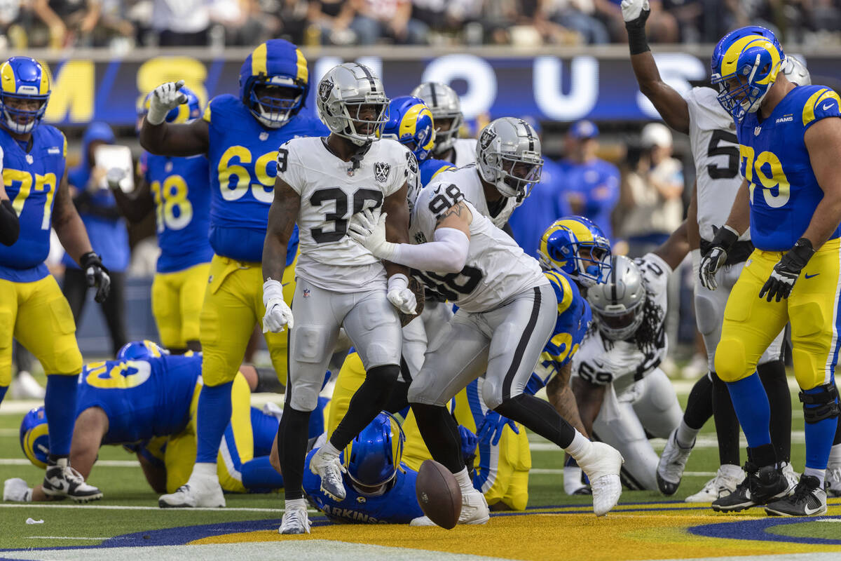 Raiders cornerback Nate Hobbs (39) celebrates his fourth down stop of Los Angeles Rams running ...