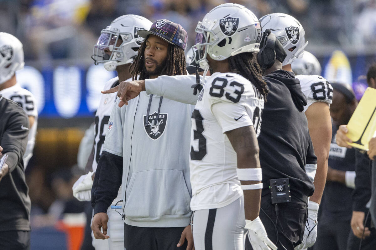 Raiders wide receiver Jakobi Meyers watches the game against the Los Angeles Rams from the side ...