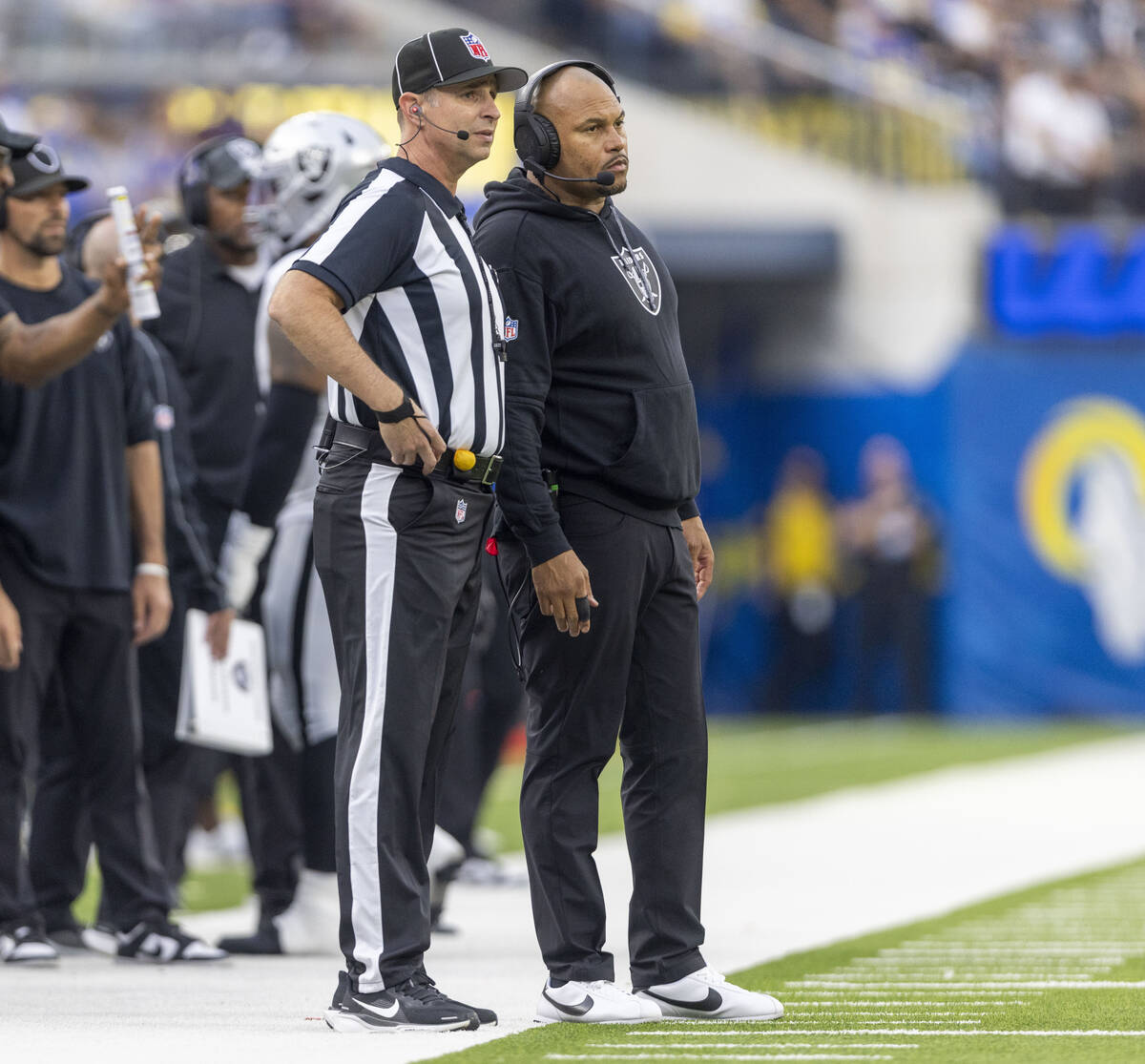 Raiders head coach Antonio Pierce looks on as a referee explains a penalty during the second ha ...