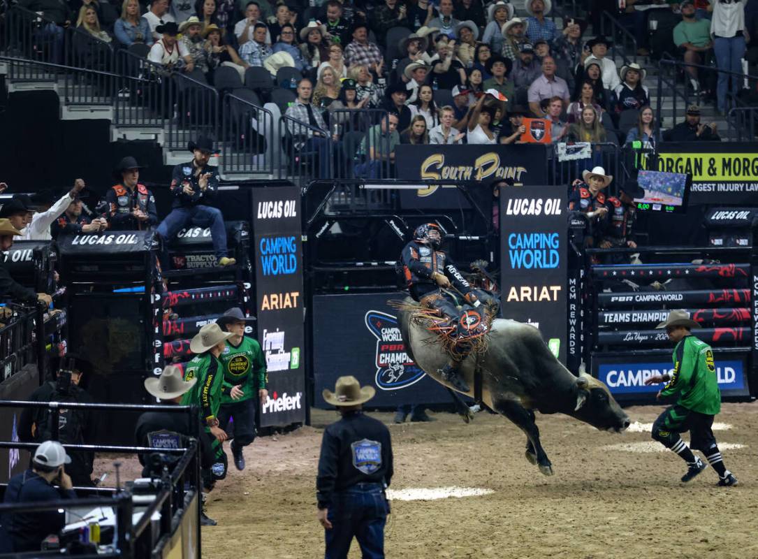 Kansas City Outlaws’ Koltin Hevalow rides a bull at the Professional Bull Riders Teams C ...