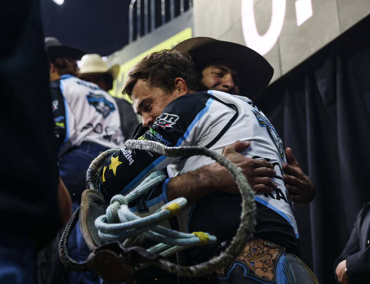 Carolina Cowboys’ Daylon Swearingen, right, hugs teammate Andrei Scoparo, left, at the P ...