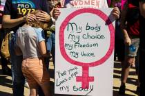 Demonstrators gather outside the Lloyd D George Courthouse during a March for Reproductive Righ ...