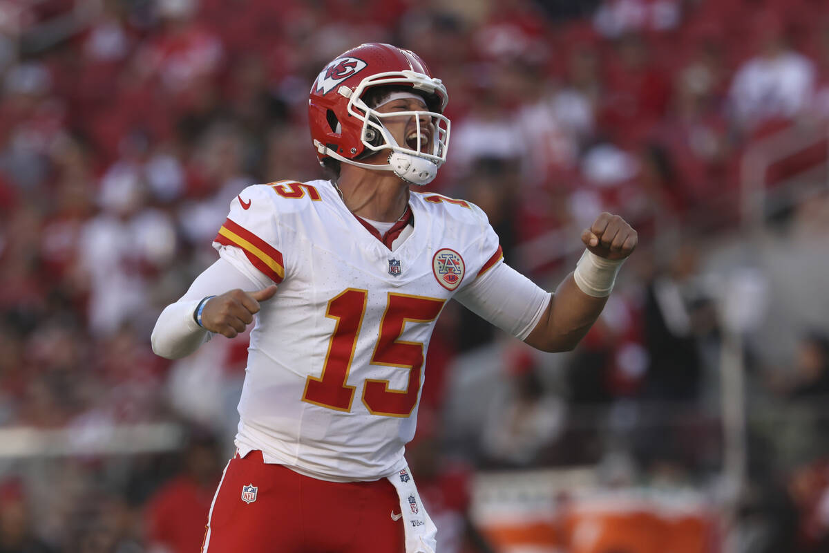 Kansas City Chiefs quarterback Patrick Mahomes (15) celebrates after a touchdown by Mecole Hard ...