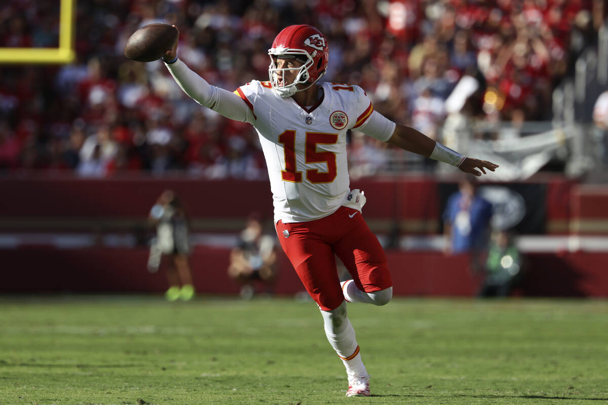 Kansas City Chiefs quarterback Patrick Mahomes (15) runs against the San Francisco 49ers during ...