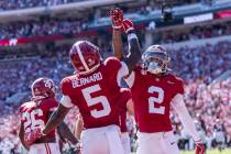 Alabama wide receivers Germie Bernard (5) and Ryan Williams (2) celebrate a touchdown by Bernar ...