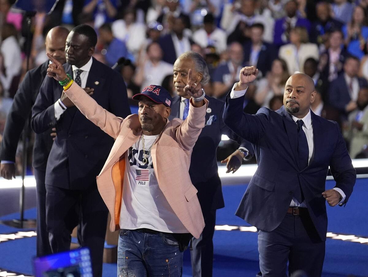 FILE - The Central Park Five join Reverend Al Sharpton during the Democratic National Conventio ...