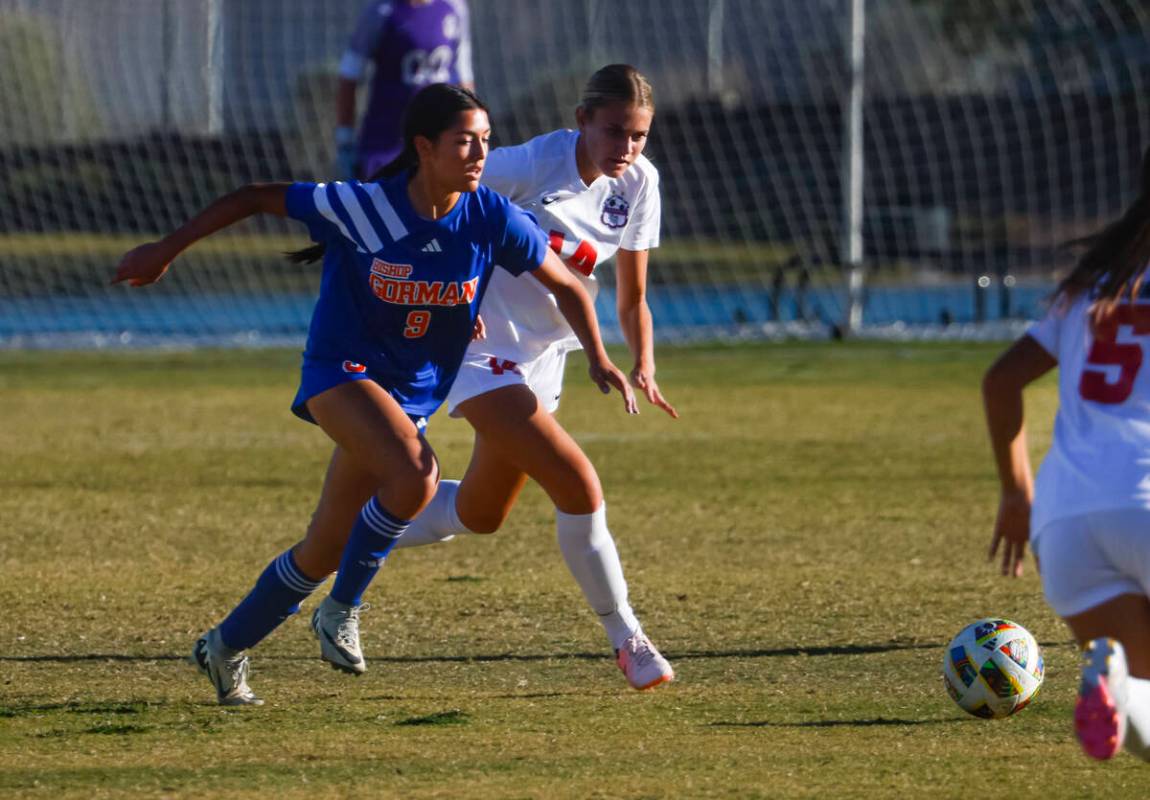 Bishop Gorman’s Alana Moore (9) and Coronado’s Allison Kleiner (14) go after the ...