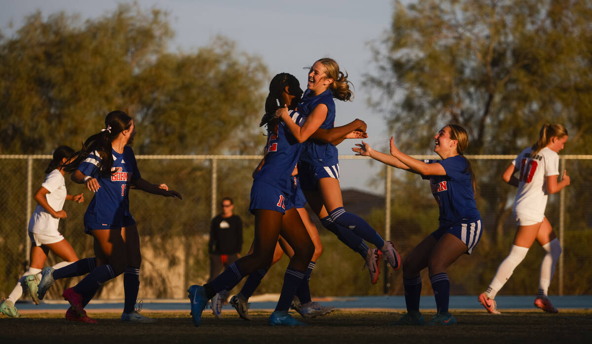 Bishop Gorman midfielder Amiya Warner (12) celebrates her goal against Coronado with Bishop Gor ...