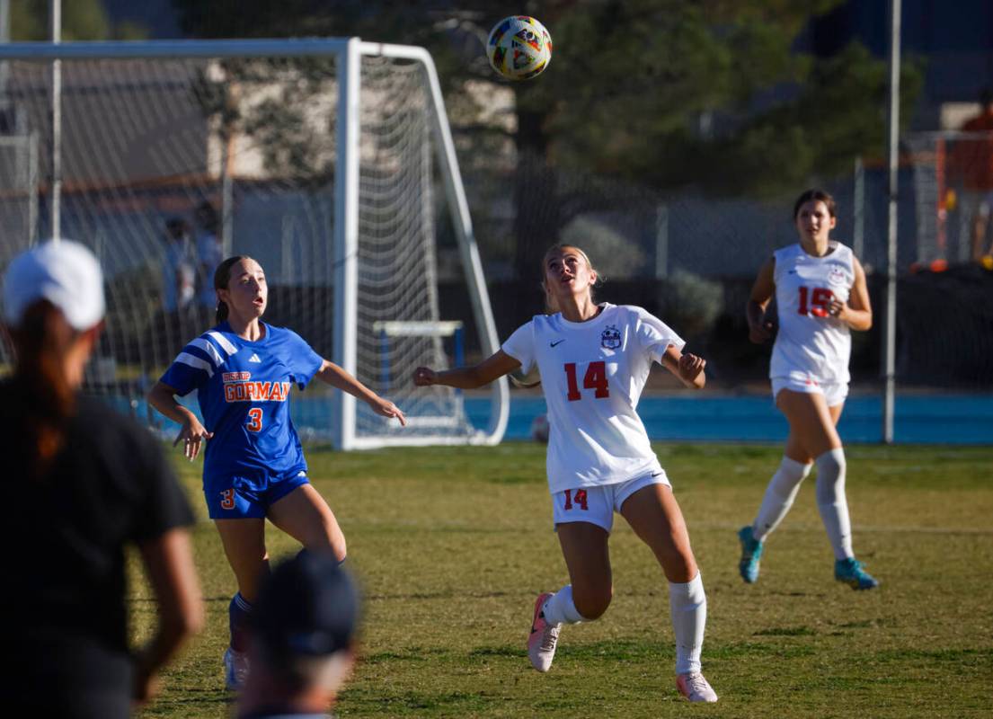 Coronado's Allison Kleiner (14) eyes the ball against Bishop Gorman midfielder Emma Flannery (3 ...