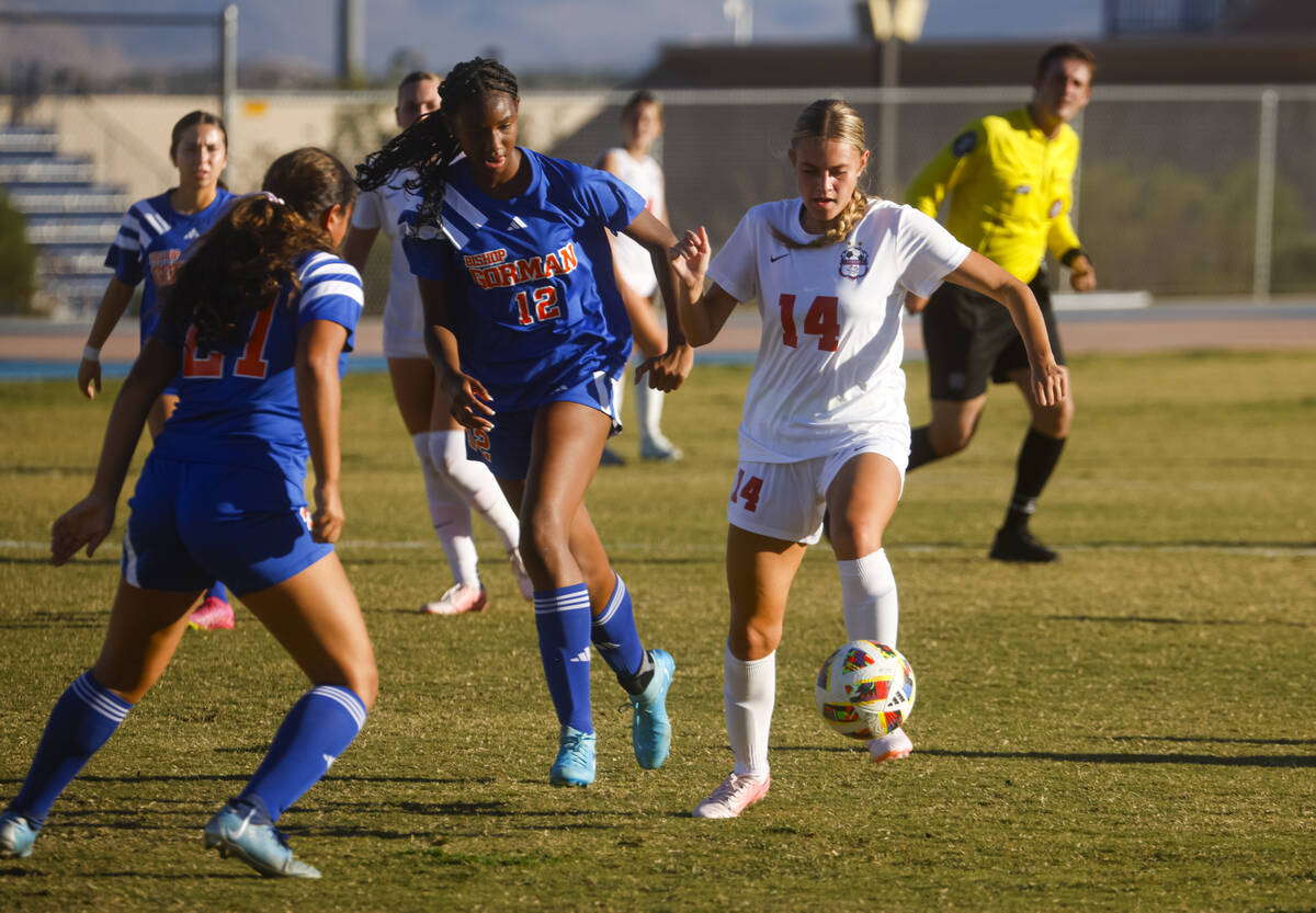 Coronado’s Allison Kleiner (14) kicks the ball under pressure from Bishop Gorman midfiel ...