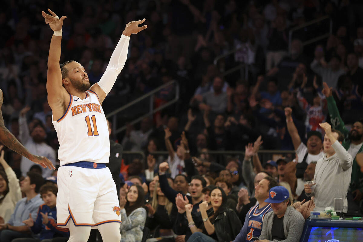 New York Knicks guard Jalen Brunson celebrates after a basket during the first half of a presea ...