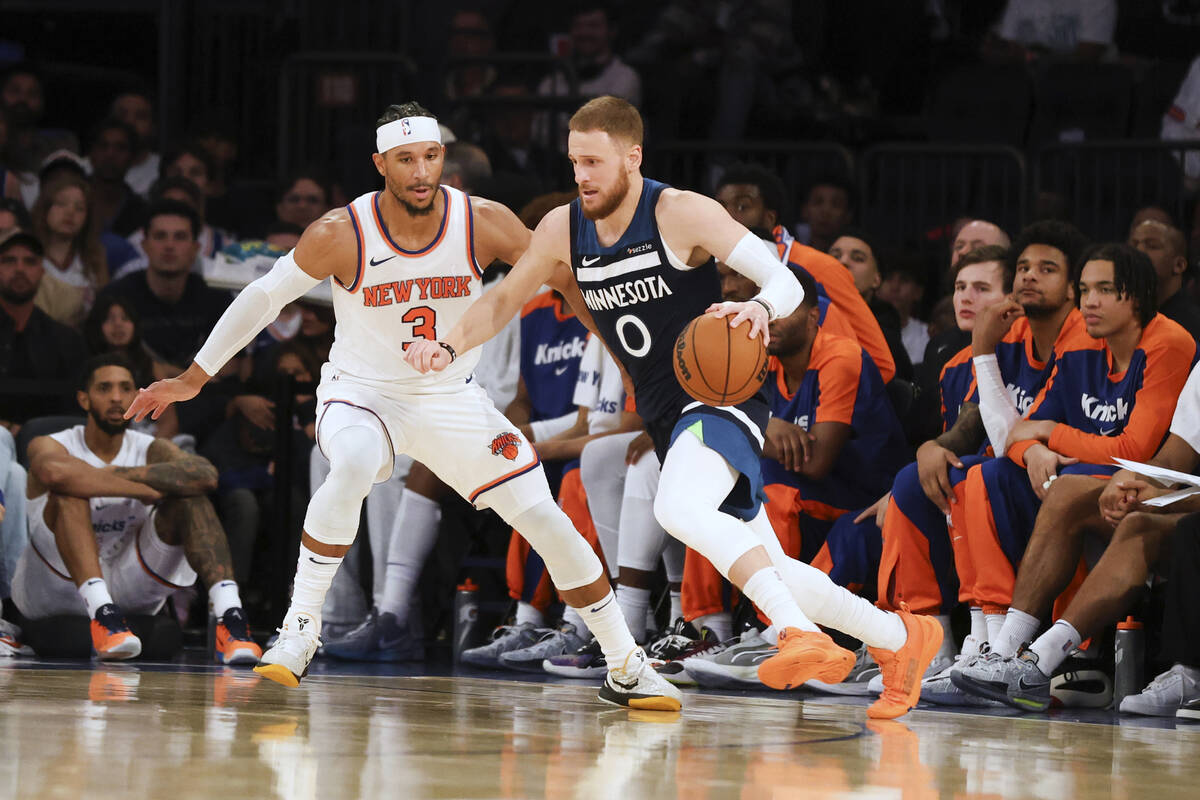 Minnesota Timberwolves guard Donte DiVincenzo is defended by New York Knicks' Josh Hart during ...