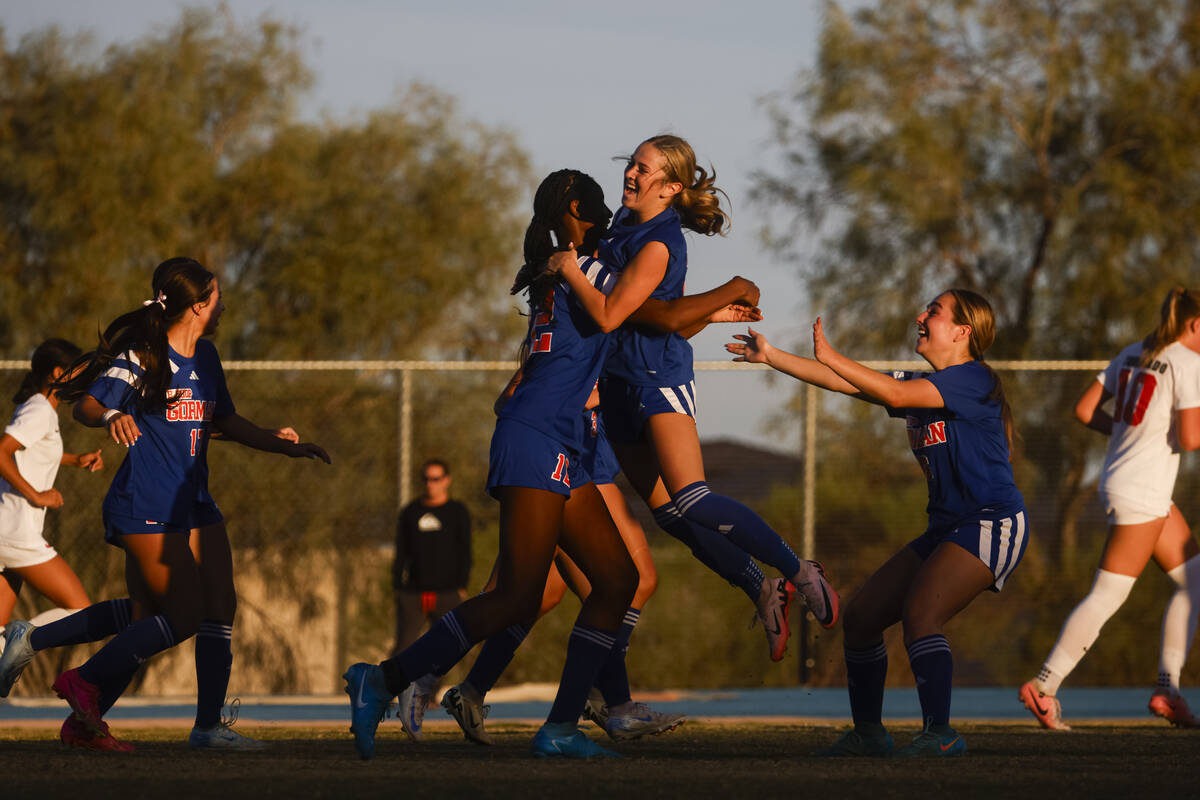 Bishop Gorman midfielder Amiya Warner (12) celebrates her goal against Coronado with Bishop Gor ...