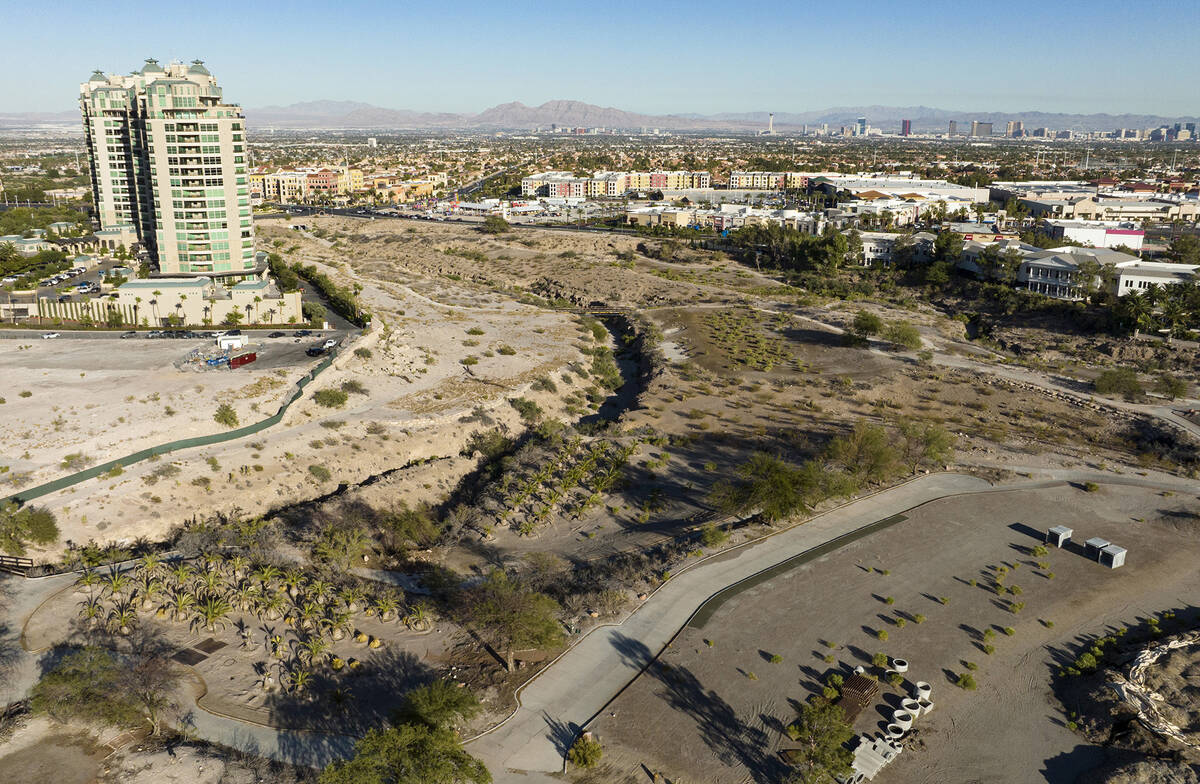 An aerial view of the shuttered Badlands Golf Course and the Queensridge towers, left, on Tuesd ...