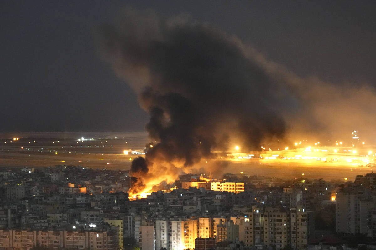 Flames and smoke rise form an Israeli airstrike on Dahiyeh, in the southern suburb of Beirut, L ...