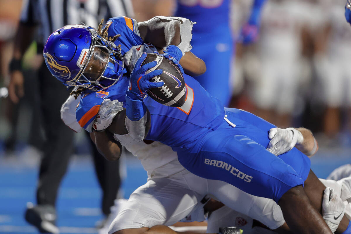 Boise State running back Ashton Jeanty (2) falls into the end zone on a 14 yard touchdown run a ...