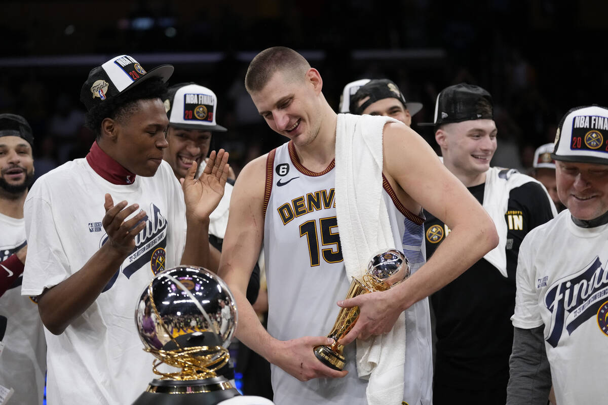 Denver Nuggets center Nikola Jokic holds the series MVP trophy after Game 4 of the NBA basketba ...