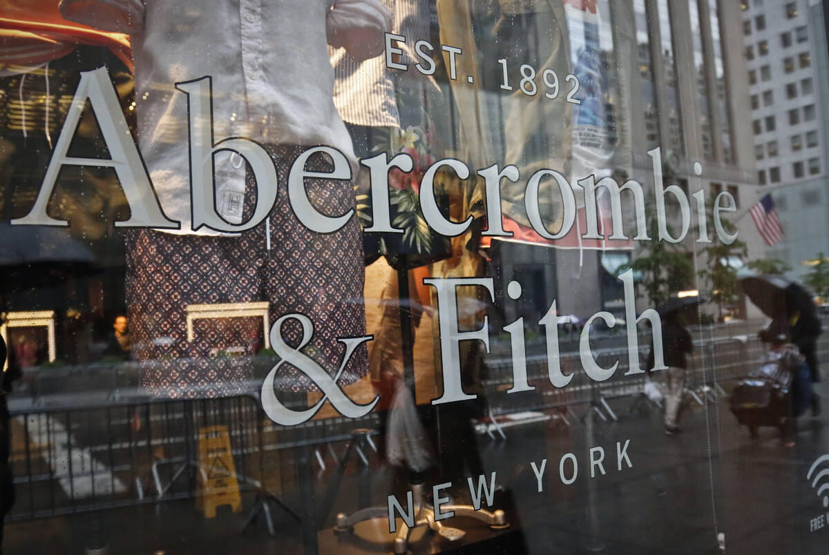 In this May 22, 2017, file photo, a store window reflects a street scene at an Abercrombie & Fi ...