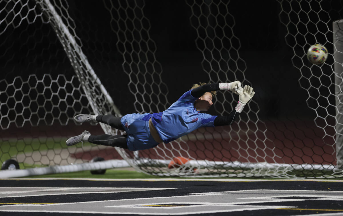 Palo Verde goalkeeper Landon Blanchard dives for a shot from Coronado that hit a goalpost durin ...