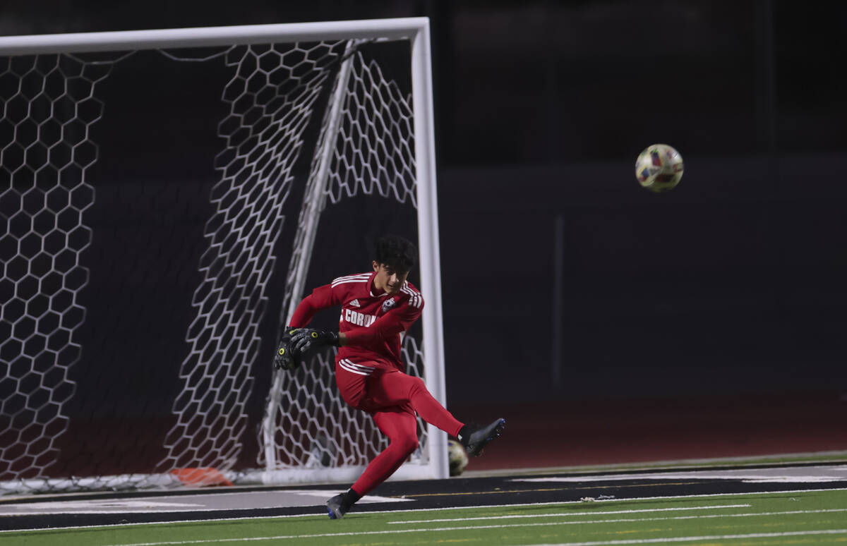 Coronado goalkeeper Logan Pierce kicks the ball during a soccer game at Palo Verde High School ...