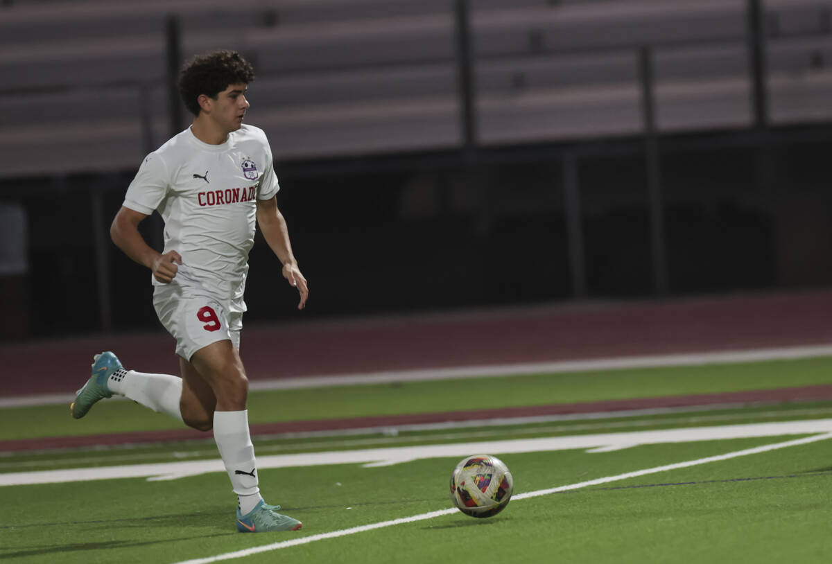 Coronado's Dylan Flores brings the ball up the field during a soccer game at Palo Verde High Sc ...